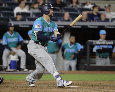 Seattle Mariners' Yonder Alonso follows through on a home run during the 11th inning of a baseball game against the New York Yankees on Friday, Aug. 25, 2017, in New York. (Frank Franklin II / Associated Press)