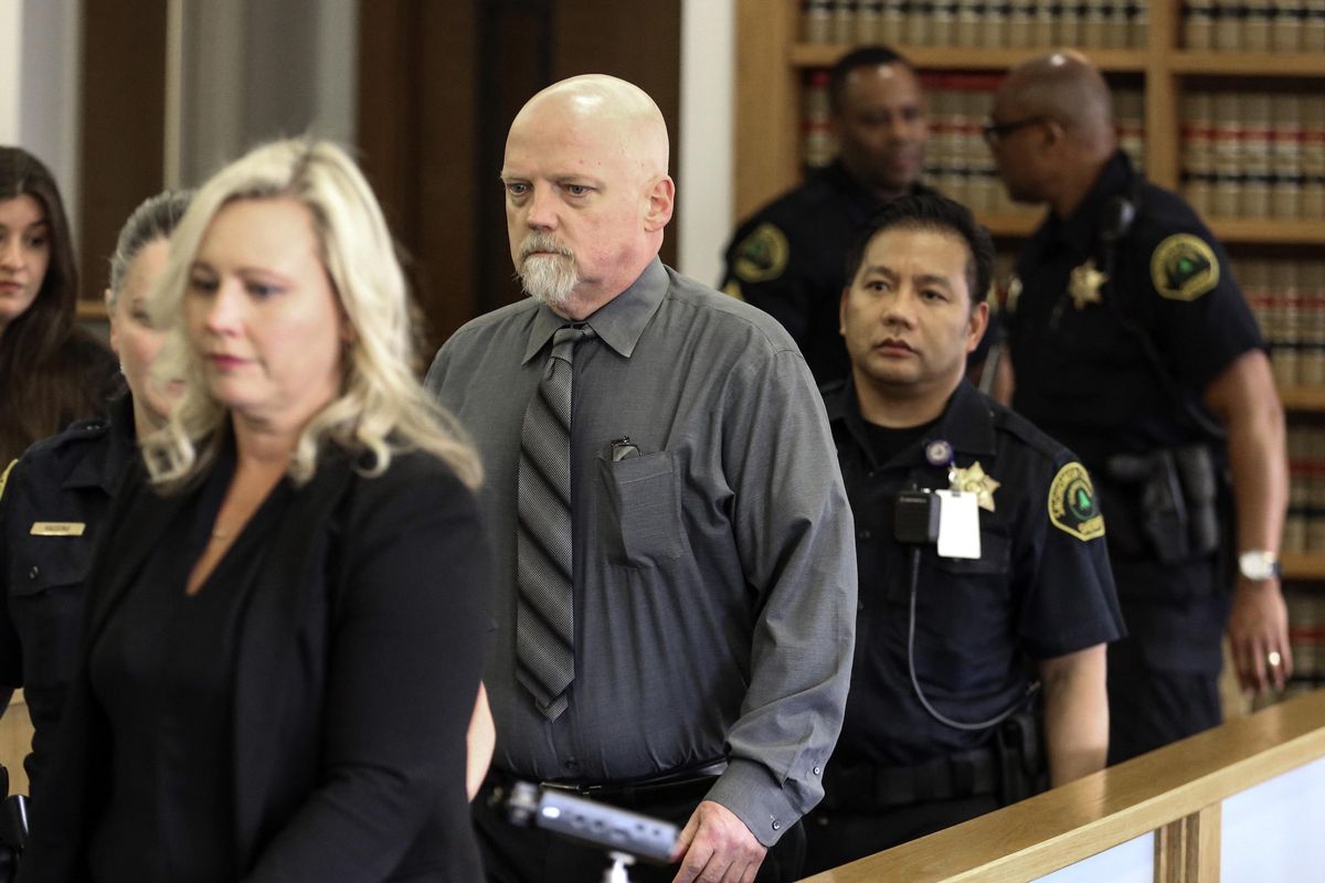 William Talbott II, center, in escorted to his seat Friday June 28, 2019 at the Snohomish County Courthouse in Everett, Wash. William Earl Talbott II has been found guilty in the 1987 killings of a young Canadian couple. (Kevin Clark / Daily (Everett) Herald)