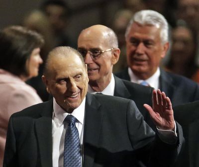 FILE - In this April 4, 2015, file photo, President Thomas S. Monson, of The Church of Jesus Christ of Latter-day Saints, waves to the audience during the opening session of the Mormon church conference in Salt Lake City. Monson, the 16th president of the Mormon church, died after nine years in office. He was 90. (AP Photo/Rick Bowmer, File) ORG XMIT: UTRB104 (Rick Bowmer / AP)