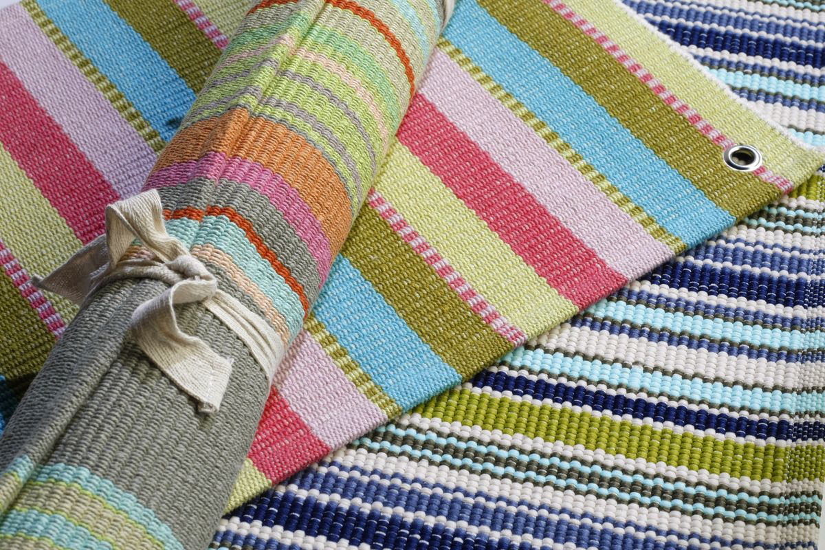 Area rugs can add  warmth to a  child’s room or  laundry room. Dash and Albert hand-woven cotton rugs in Cabana and Stone Soup combine turquoise with pinks, corals, khakis and blues. McClatchy-Tribune photos (McClatchy-Tribune photos)