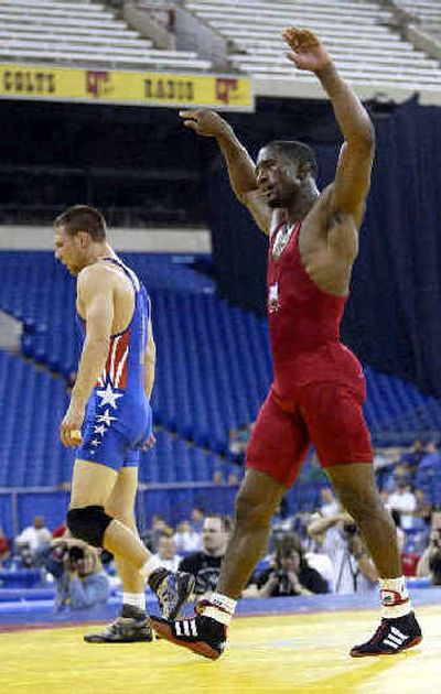 
Jamill Kelly, right, celebrates his win over Sandpoint grad Jared Lawrence for a spot on the U.S. Olympic team.Jamill Kelly, right, celebrates his win over Sandpoint grad Jared Lawrence for a spot on the U.S. Olympic team.
 (Associated PressAssociated Press / The Spokesman-Review)