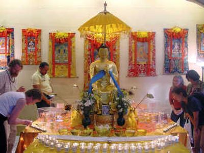 
Visitors survey relics on display at BodhiTree, in Los Angeles. Photos courtesy of Maitreya Project International
 (Photos courtesy of Maitreya Project International / The Spokesman-Review)