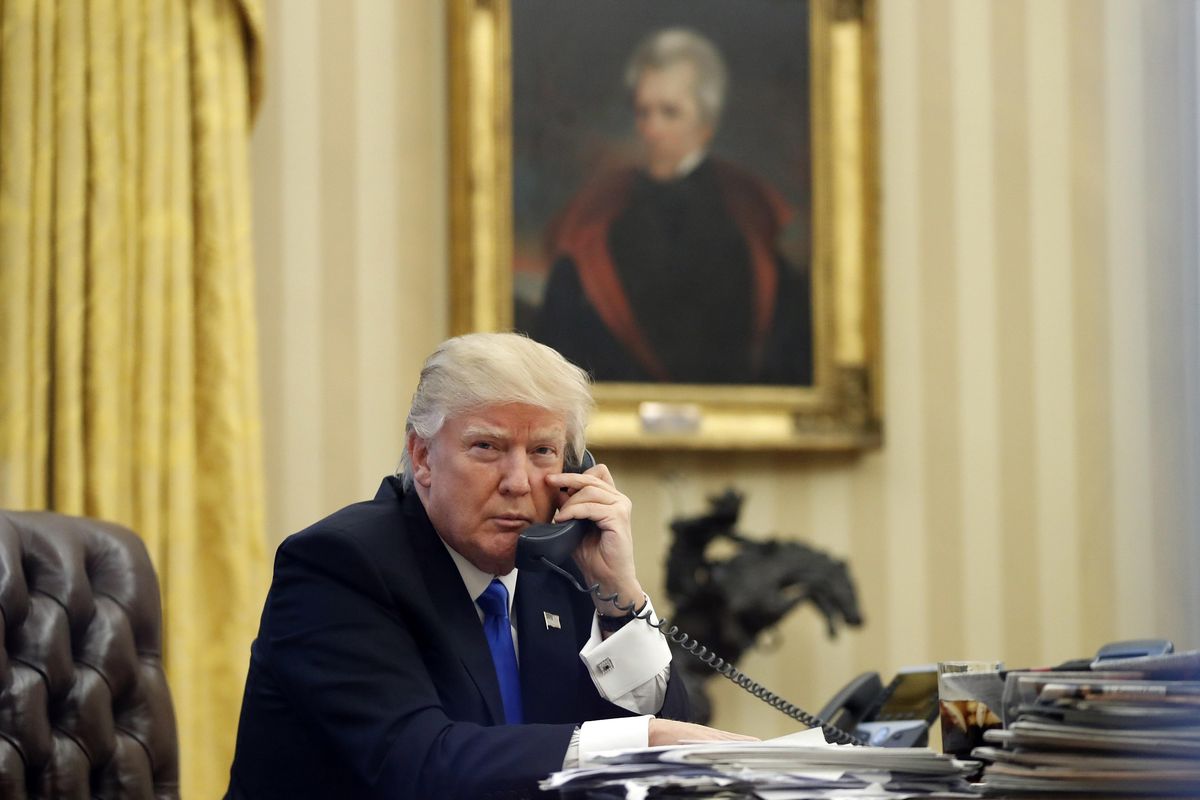 In this Saturday, Jan. 28, 2017 file photo, President Donald Trump speaks on the telephone  in the Oval Office of the White House. In the background is a portrait of former President Andrew Jackson which Trump had installed in the first few days of his administration. (Alex Brandon / Associated Press)