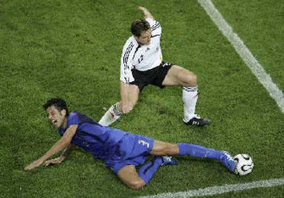 
Fabio Grosso and his Italian teammates know how to take a dive. 
 (Associated Press / The Spokesman-Review)