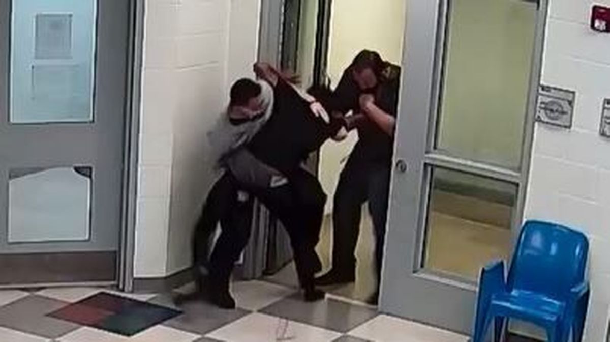 This still image from a security camera provided by Sedgwick County shows Cedric "CJ" Lofton struggling with staff on Sept. 24, 2021 at the Sedgwick County Juvenile Intake and Assessment Center in Wichita, Kan. Sedgwick County released 18 video clips late Friday, Jan. 21, 2022, of what happened before Lofton was rushed to a hospital on Sept. 24. He died two days later.  (Sedgwick County)