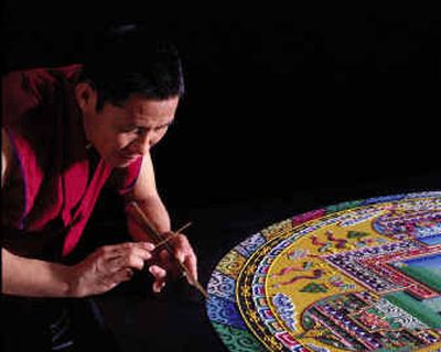 
A Tibetan Buddhist monk creates Mandala sand painting. Monks will perform the artform at the Coldwater Creek Bridge as part of Festival of Spirit in Sandpoint on Thursday and Friday. 
 (Photo courtesy of Morning Light Foundation / The Spokesman-Review)