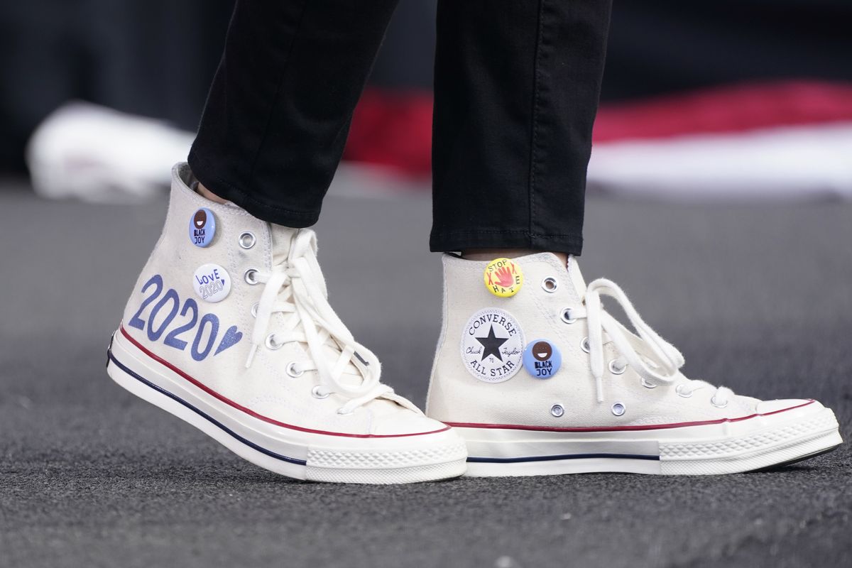 Converse high-top sneakers of Democratic vice presidential candidate Sen. Kamala Harris, D-Calif., are shown as she speaks at a drive-in early voting event, Saturday, Oct. 31, 2020, in Miami, Fla.  (Associated Press)