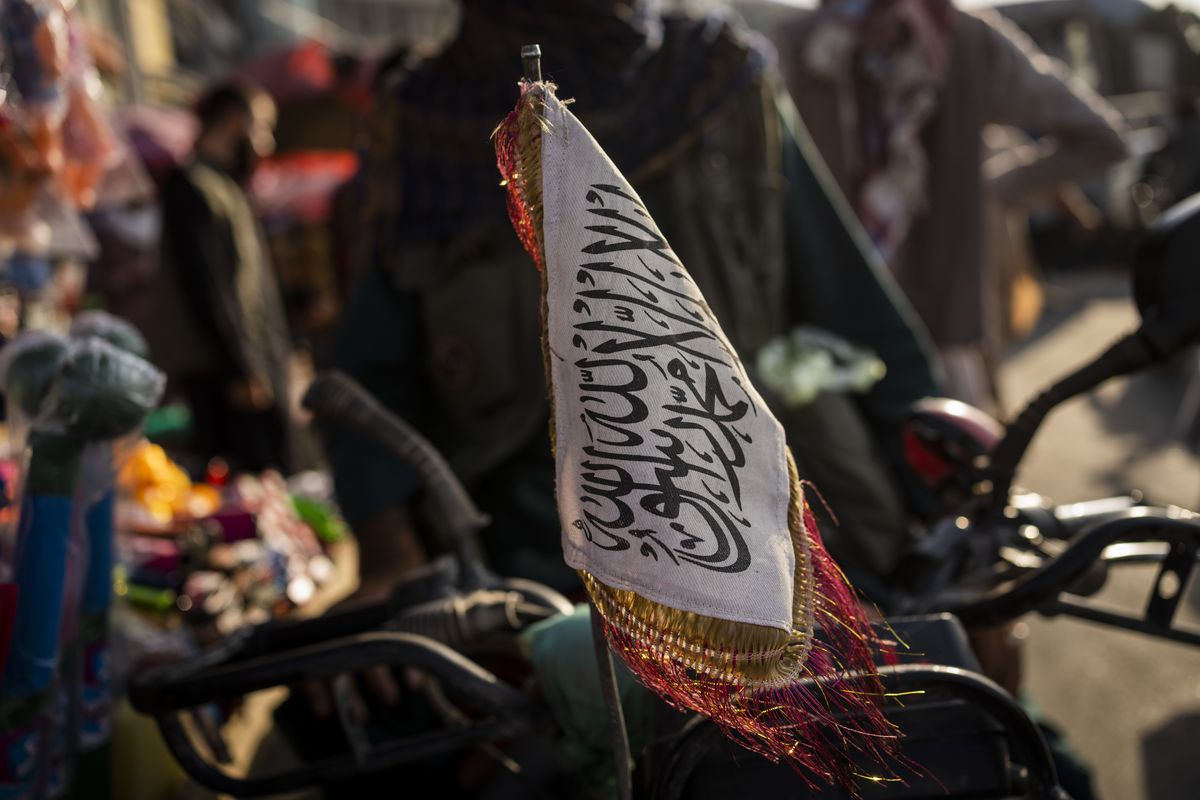 A Taliban flag is placed in the front of a motorbike in Kabul, Afghanistan, Tuesday, Sept. 28, 2021.  (Bernat Armangue)