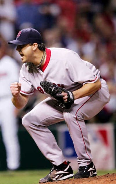 
Josh Beckett allowed only five hits in eight innings of Game 5. Associated Press
 (Associated Press / The Spokesman-Review)