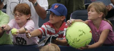 
Young fans seek autographs after Wednesday's U.S. Open match between Daniela Hantuchova and Maria Emilia Salerni. 
 (Associated Press / The Spokesman-Review)