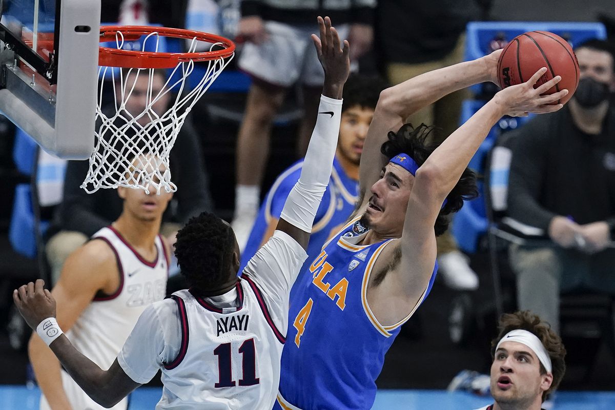 UCLA guard Jaime Jaquez Jr. (4) shoots over Gonzaga guard Joel Ayayi (11) during the first half of a men's Final Four NCAA college basketball tournament semifinal game, Saturday, April 3, 2021, at Lucas Oil Stadium in Indianapolis. (AP Photo/Michael Conroy) ORG XMIT: INCN305  (Michael Conroy)