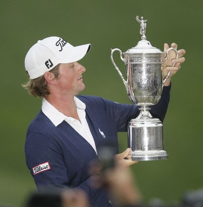 Webb Simpson posses with the championship trophy after the U.S. Open Championship golf tournament Sunday, June 17, 2012, at The Olympic Club in San Francisco. (Eric Risberg / Associated Press)