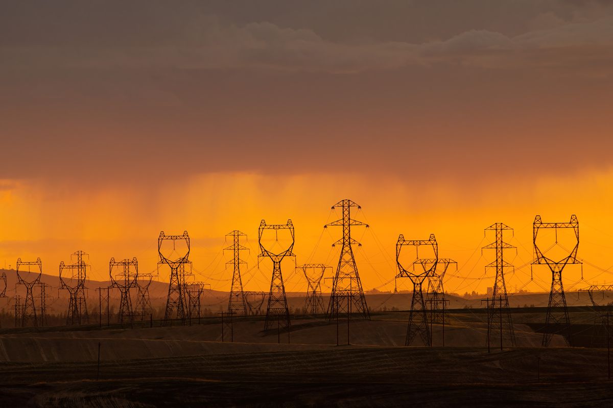 The sun sets on May 25 behind BPA overhead transmission power lines just north of Davenport, Wash. The lines carry hydroelectric power originating from Grand Coulee Dam.  (COLIN MULVANY/THE SPOKESMAN-REVIEW)