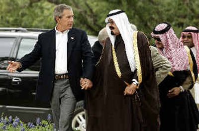 
President Bush greets Saudi Crown Prince Abdullah at his ranch in Crawford, Texas, on Monday. Bush was seeking relief from record-high gasoline prices and support for Middle East peace as he met with Abdullah. 
 (Associated Press / The Spokesman-Review)