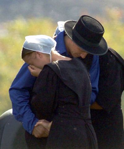 
Members of the Amish community come together to share their sorrow in the village of Nickel Mines, Pa., on Tuesday, following Monday's shootings  at a one-room schoolhouse. 
 (Associated Press / The Spokesman-Review)