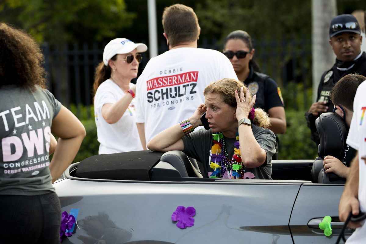 Rep. Debbie Wasserman Schultz, D-Fla., makes a call after a truck drove into a crowd of people during The Stonewall Pride Parade and Street Festival in Wilton Manors, Fla., Saturday, June 19, 2021. A driver has slammed into spectators at the start of a Pride parade in South Florida, injuring at least two people.  (Chris Day)