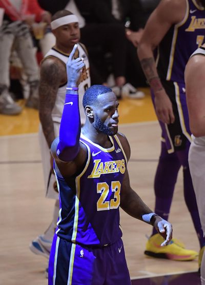 Los Angeles Lakers forward LeBron James gestures after scoring during the first half of the team’s NBA basketball game against the Denver Nuggets on Wednesday, March 6, 2019, in Los Angeles. With the basket, James passed Michael Jordan for fourth place on the NBA’s career scoring list. (Mark J. Terrill / Associated Press)