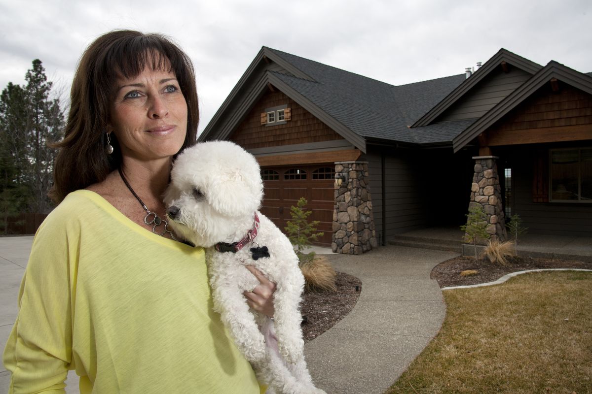 Linda Elkin learned her lesson when it came to taking on a home-building project. “The worst business deal I ever made” was hiring a contractor who dragged out the project, she said. She built this new home on the South Hill after her first setback, and shares it with her dog, Joey. (Dan Pelle)