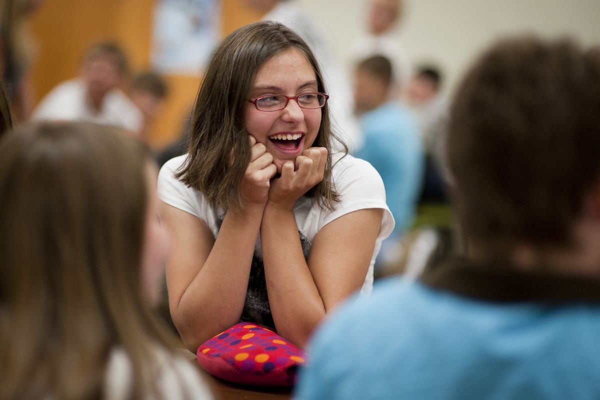 Seventh- grader Leanne Grassman, 12, chats with friends during lunch on the first day of classes at East Valley Middle School.
