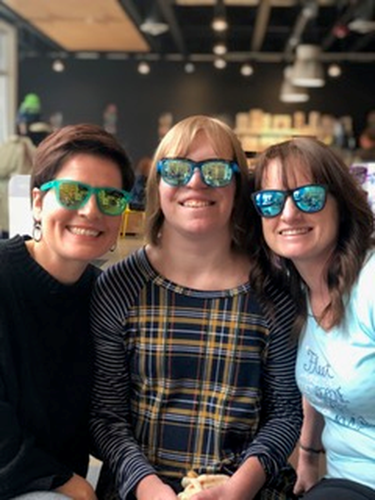 From left: Janet Carney, Grace Carney and Jessicah Travis pose for a picture in Fleet Feet Spokane in Kendall Yards, on April 13. (Jessicah Travis / Courtesy)