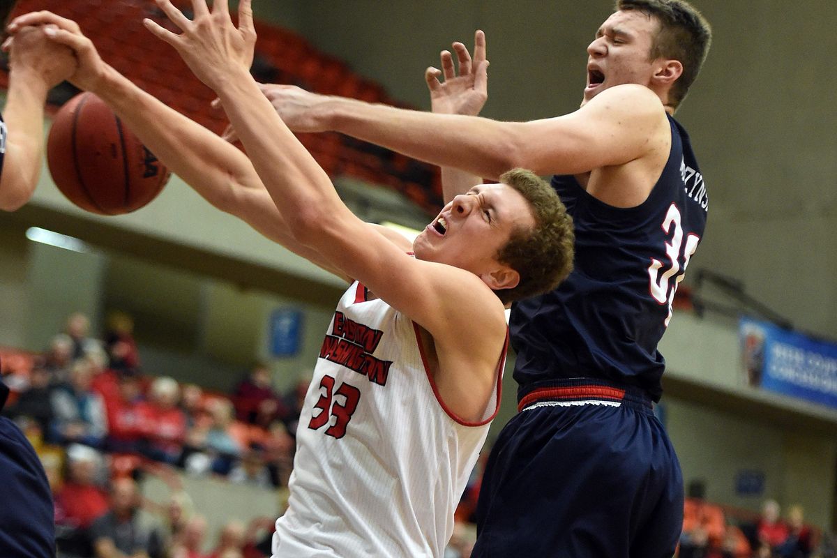 Eastern Washington forward Jacob Groves (33) is fouled by Belmont center Nick Muszynski (33) during the second half of a college basketball game, Tues., Nov. 26, 2019, in Cheney, Wash. (Colin Mulvany / The Spokesman-Review)