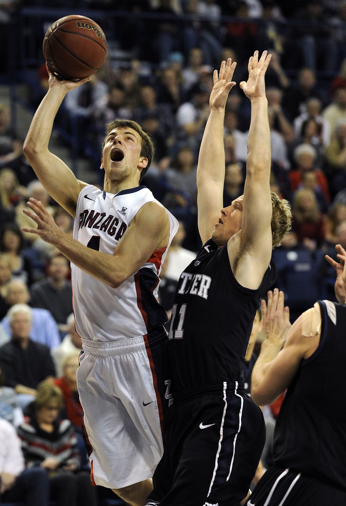 Zags guard Kevin Pangos, left, looks to the basket over Butler’s Jackson Aldridge. Pangos scored 19 points. (Colin Mulvany)