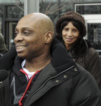 Michael Tillman talks with reporters in Chicago on Thursday as his mother, Winter Tillman, looks on from the background.  (Associated Press)