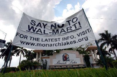 
Residents of a Miramar, Fla. community show their opposition to a planned Wal-Mart super store earlier this year.  In an unusual move, the world's largest company is sponsoring a gathering of noted economists who will debate the company's impact. 
 (Associated Press / The Spokesman-Review)