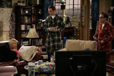 
In this image released by CBS, cast members, from left, Kaley Cuoco, Jim Parsons and Johnny Galecki, are shown in a scene from CBS' 