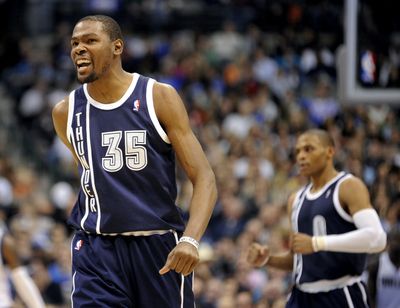 Kevin Durant, left, scored 52 and Russell Westbrook 31 for Oklahoma City in its win at Dallas. (Associated Press)