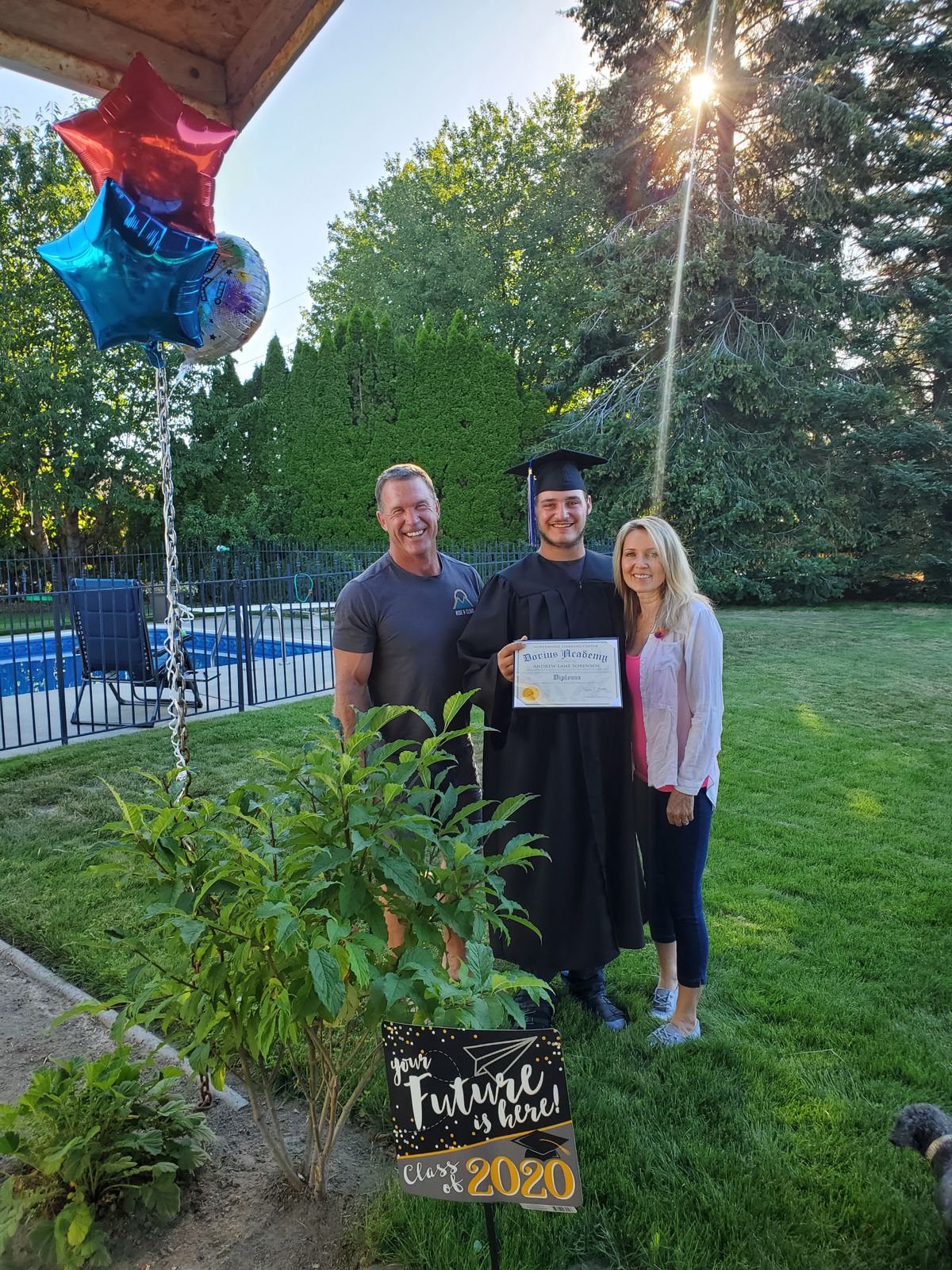 Andrew Sorensen, center, along with his parents, Randy and Theresa Sorensen, celebrate his high school graduation in June 2020.  (Courtesy of the Sorensen family)