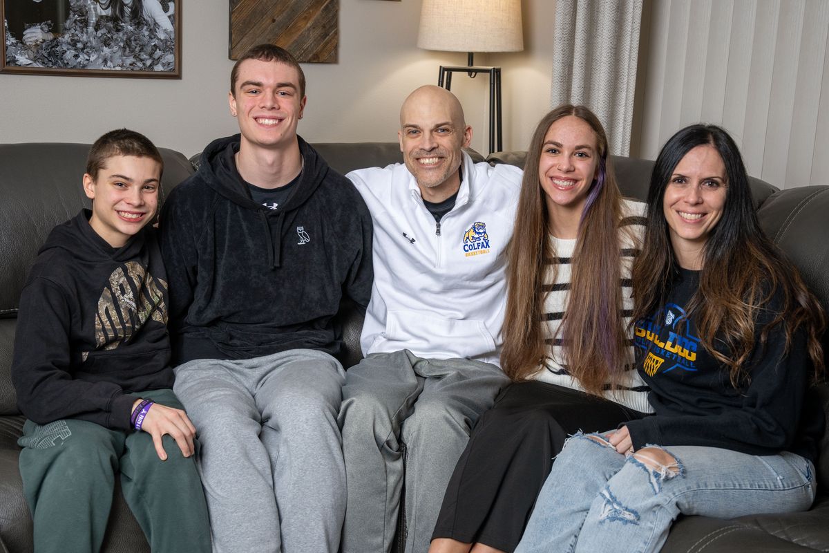 The Jenkin family left to right: Ryker, Adrik, Reece, Allie and Breanne. Colfax boys basketball coach Reece Jenkin was recently diagnosed with stage 4 pancreatic cancer.  (COLIN MULVANY)