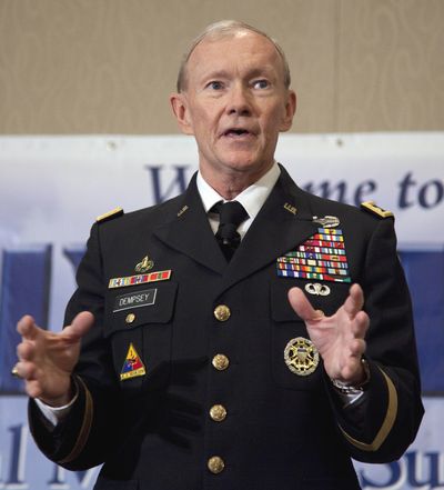 Army Chief of Staff Gen. Martin Dempsey speaks to relatives of fallen service members Friday in Arlington, Va. (Associated Press)