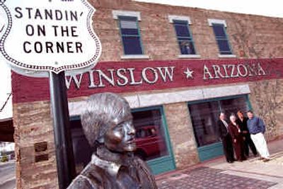
Members of the La Posada Foundation, a group formed to promote the revitalization of downtown Winslow, Ariz., admire the statue in the Standin' on the Corner Park. Pictured from left are Larry Payne, MarieLaMar, Connie Hackler and Loren Sadler. 
 (Associated Press / The Spokesman-Review)