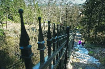 
The Moore-Turner Heritage Garden, left of the fence, has been cleared, and new pathways are almost finished. 
 (Christopher Anderson / The Spokesman-Review)