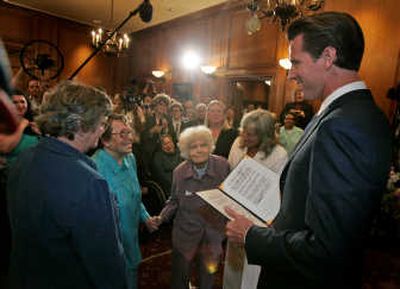 
San Francisco Mayor Gavin Newsom, right, marries Phyllis Lyon, 84, second from left, and Del Martin, 87, third from left, in a ceremony at City Hall in San Francisco on Monday. Associated Press
 (Associated Press / The Spokesman-Review)