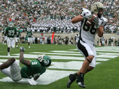 
Idaho's Lee Smith beats Michigan State defensive back Demond Williams for a fourth-quarter score. 
 (Associated Press / The Spokesman-Review)