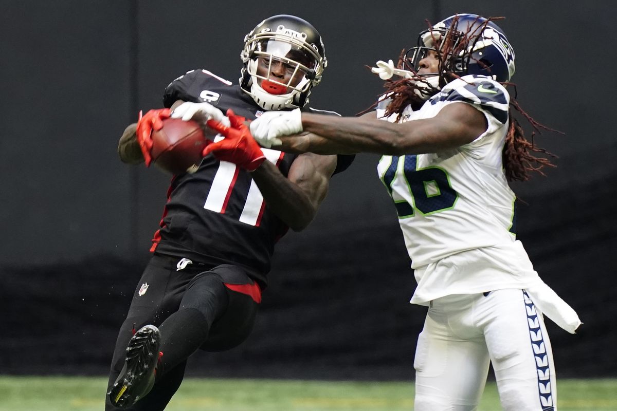 Seattle Seahawks quarterback Russell Wilson (3) works against the Atlanta  Falcons during the fi …