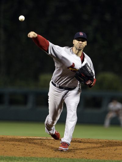 Chris Carpenter gave up three hits and walked none in his complete-game victory over Philadelphia. (Associated Press)