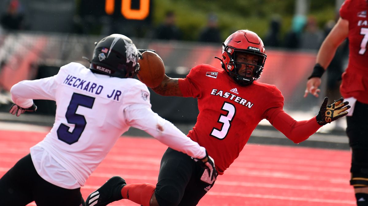 EWU quarterback Eric Barriere (3) runs the ball as Weber State cornerback Eddie Heckard (5) move in to tackle during the first half of a college football game, Sat, Oct. 23, 2021, at Roos Field in Cheney, Wash.  (Colin Mulvany/THE SPOKESMAN-REVIEW)
