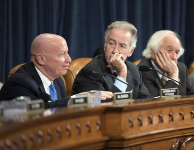 House Ways and Means Committee Chairman Kevin Brady, R-Texas, left, joined by Rep. Richard Neal, D-Mass., the ranking member, and Rep. Sander Levin, D-Mich., offers his manager's amendment as the GOP tax bill debate enters the final stage, on Capitol Hill in Washington, Thursday, Nov. 9, 2017. (J. Scott Applewhite / Associated Press)