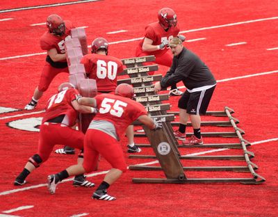 Offensive line coach Aaron Best will have seven seniors this fall. Four of his other five linemen are redshirt freshmen. (FILE)