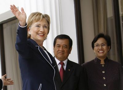 Secretary of State Hillary Rodham Clinton waves to journalists before a meeting with Indonesia’s president.  (Associated Press / The Spokesman-Review)