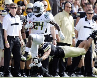 Colorado discovered that running back Kenjon Barner (24) and his Oregon Ducks are loaded with breakaway speed. (Associated Press)