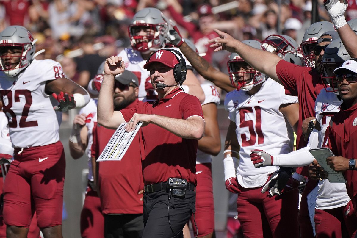 Washington State interim head coach Jake Dickert and his team celebrate a missed field goal by Arizona State during the first half of a Pac-12 game Saturday, Oct 30 in Tempe, Ariz.  (Associated Press)