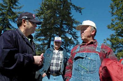
Former Forest Service employee Gerry House, left, talks on Tuesday with Del Kerr, right, about a proposal to sell the Forest Service's English Point property to fund a federal schools bill. 
 (Jesse Tinsley / The Spokesman-Review)