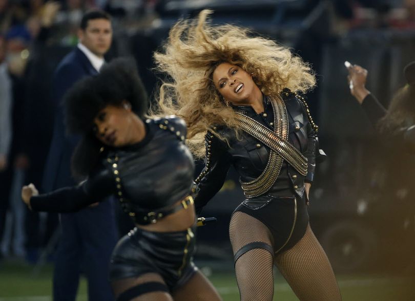 Beyonce performs during halftime of the NFL Super Bowl 50 football game in Santa Clara, Calif. Beyonce is working overtime this weekend: After releasing a new song Saturday and performing at the Super Bowl on Sunday, she's announced a new stadium tour. The Grammy-winning singer announced her 2016 Formation World Tour in a commercial after she performed at the halftime show with Bruno Mars and Coldplay. (AP Photo/Matt Slocum, File)
