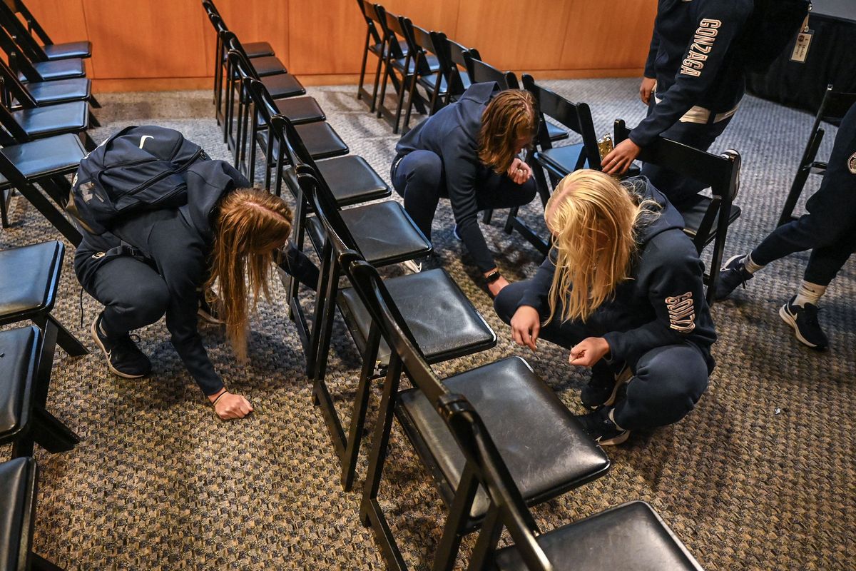 Members of the Gonzaga University Women's Soccer pick up confetti, Monday, Nov. 6, 2023, in the Herek Club after the Zags see their name announced to host a first round NCAA Tournament match against Idaho.  (DAN PELLE/THE SPOKESMAN-REVIEW)