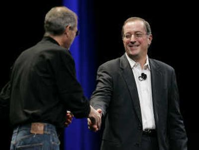 Apple CEO Steve Jobs, left, shakes hands with Intel CEO Paul Otellini during the keynote speech Tuesday at Macworld. 
 (Associated Press / The Spokesman-Review)