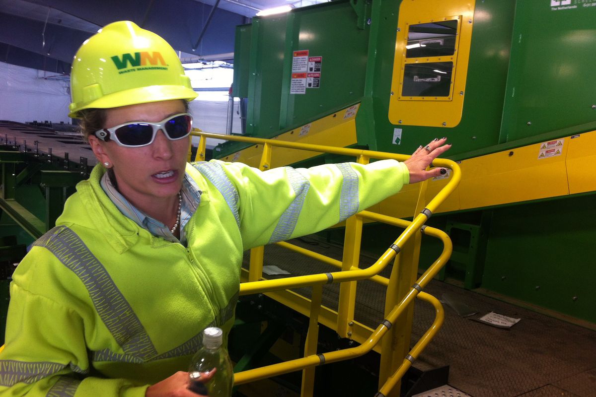 Jill Leonetti, the Waste Management’s project manager for the company’s new recycling plant in Spokane, shows a piece of equipment that will sort corrugated cardboard starting in October. (Jonathan Brunt)